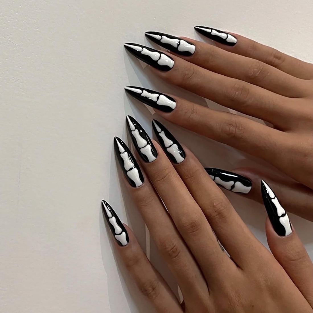 24 Pcs Almond Press on Nails Long Stiletto Fake Nails with Glue Black False Nails with Skeleton Palm Design Acrylic Nails Press ons Halloween Glue on Nails Artificial Stick on Nails for Women Girls
