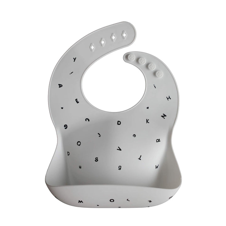 mushie Silicone Baby Bib | Adjustable Fit Waterproof Bibs (Letters White)
