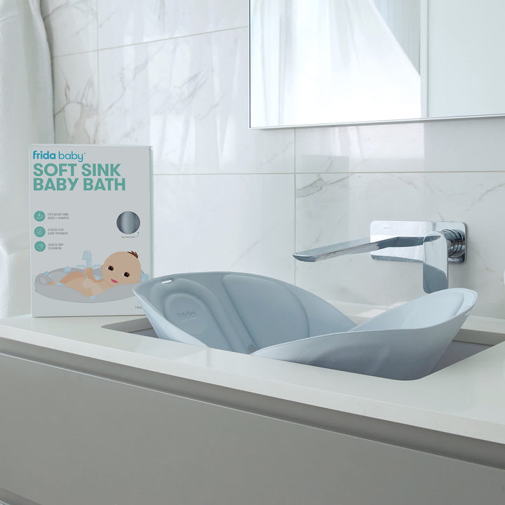Frida Baby Soft Sink Bath, Sink Bather, Easy to Clean Bather That Supports Baby's Head