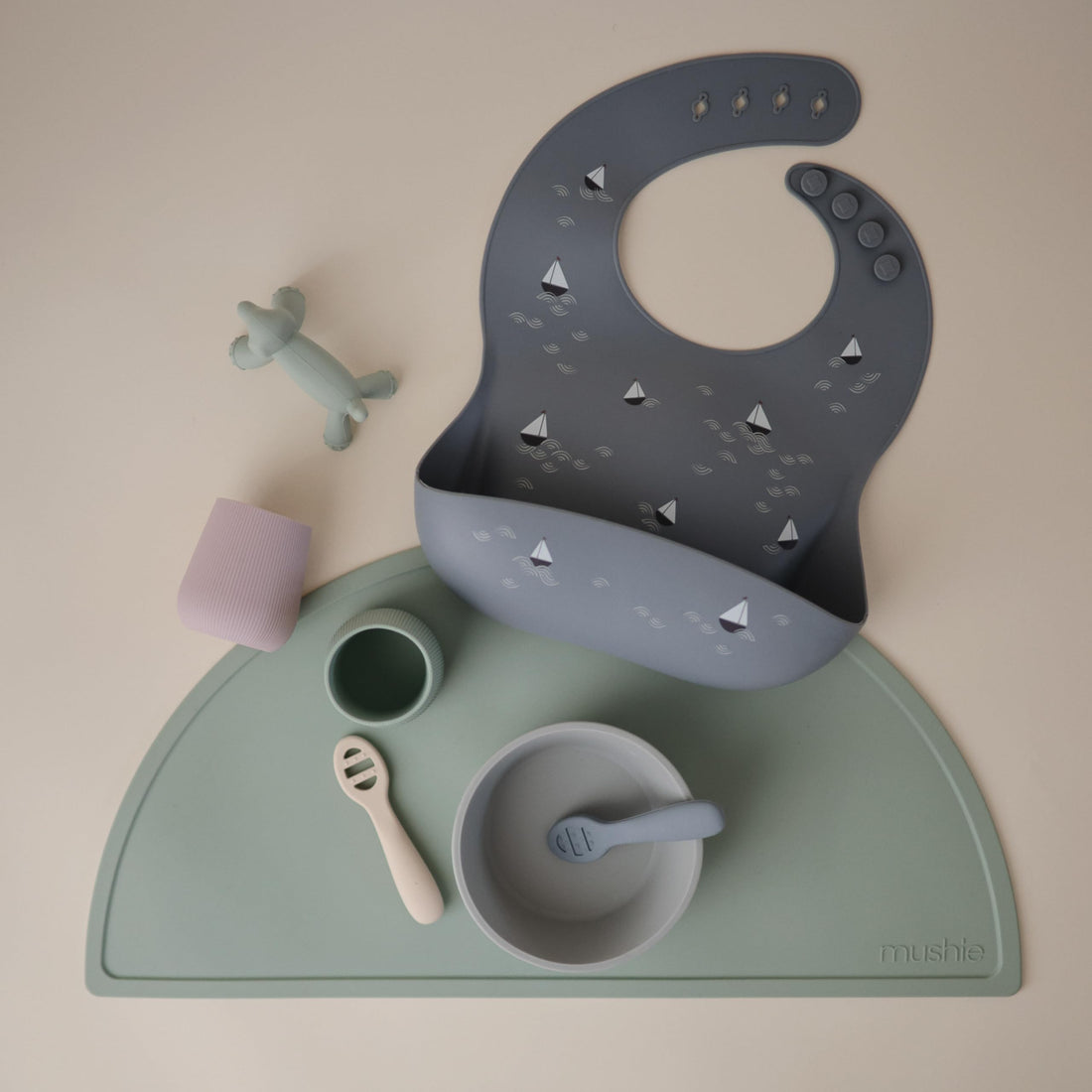 mushie Silicone Baby Bib | Adjustable Fit Waterproof Bibs (Boats)