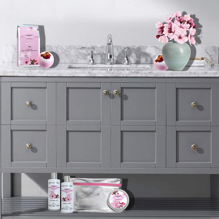 LOVERY Christmas Gifts - Bath And Body Gift Basket For Women â€“ Cherry Blossom Home Spa Set With Fragrant Lotions, 2 Extra Large Bath Bombs, Mirror And Silver Reusable Travel Cosmetics Bag