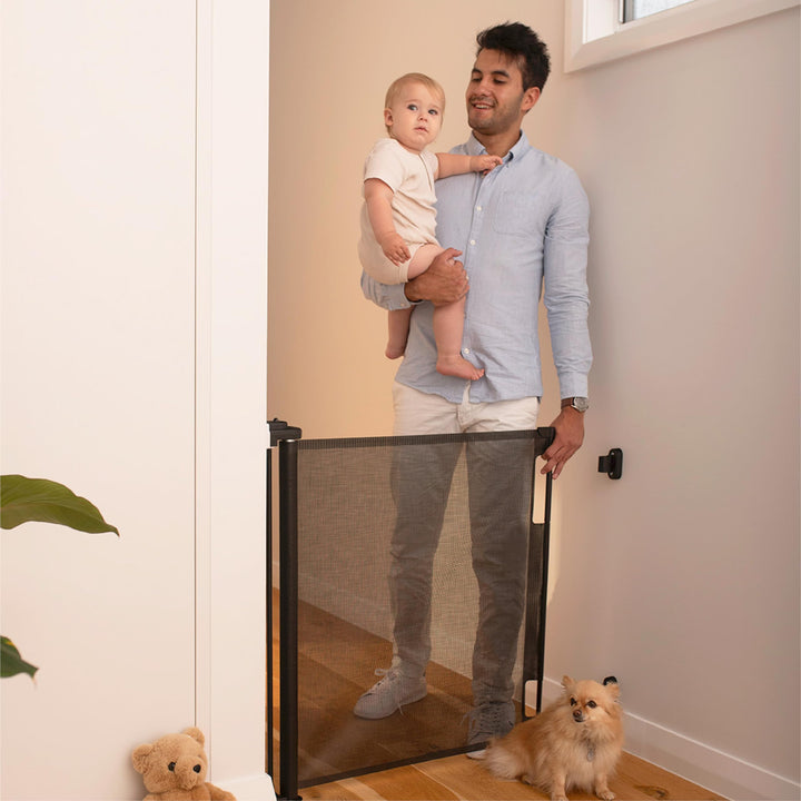 Perma Child Safety Indoor/Outdoor Retractable Baby Gate 33 Tall, Extends to 71 Wide, Black