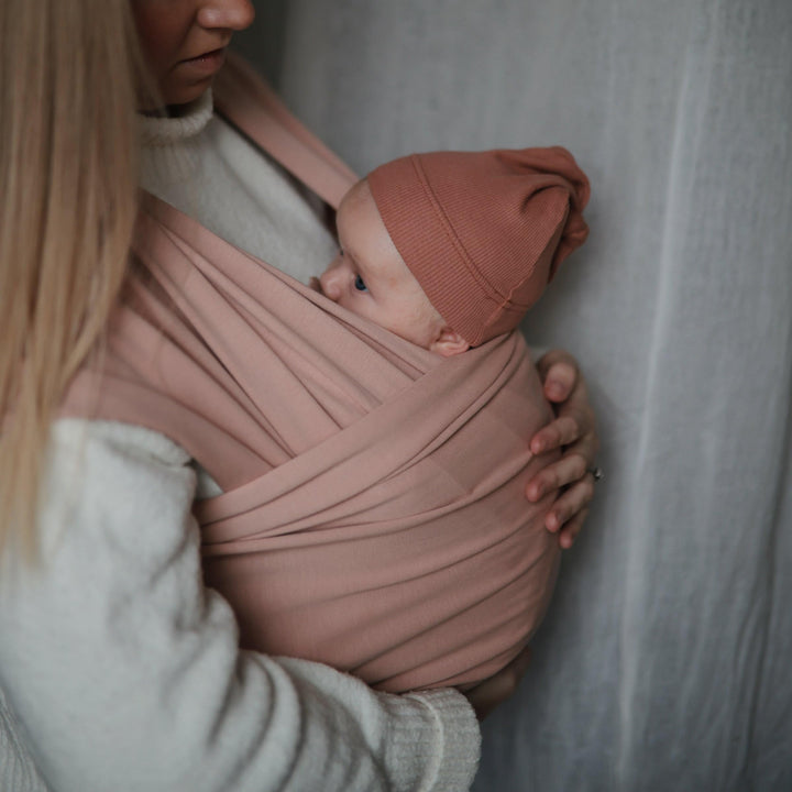 mushie Baby Wrap Carrier | Organic Cotton and Elastane | Infant Sling for Newborn and Babies 8-35 lbs (Blush)