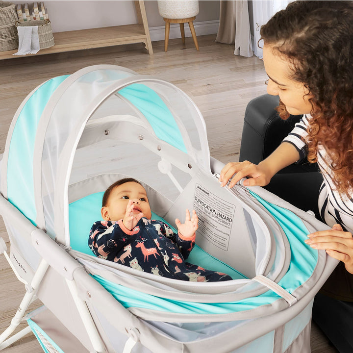 Dream On Me Karley Bassinet in Blue & Grey, Lightweight Portable Baby Bassinet, Quick Fold and Easy to Carry , Adjustable Double Canopy, Indoor and Outdoor Bassinet with Large Storage Basket.