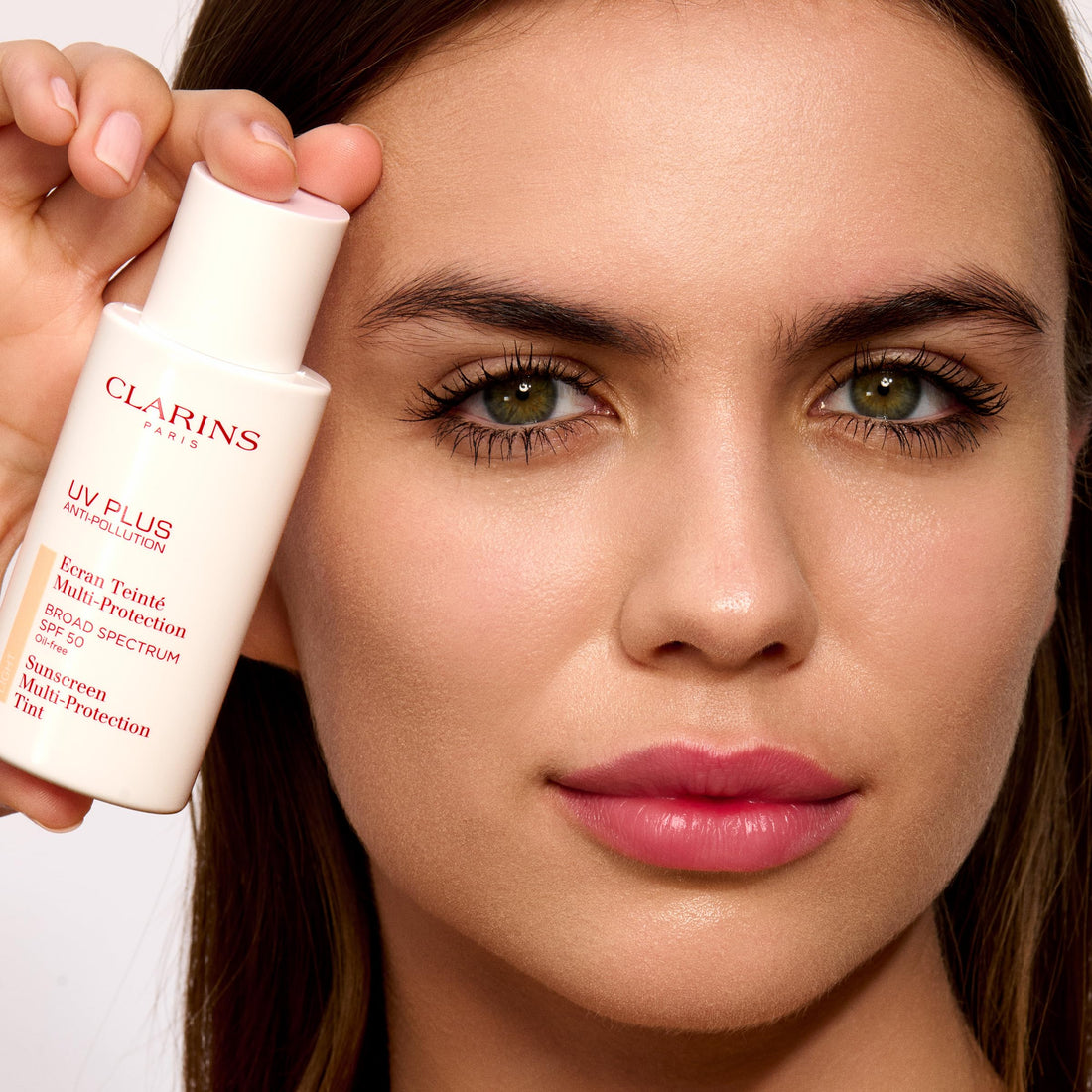 Clarins NEW UV Plus Anti-Pollution, Broad Spectrum SPF 50 Tinted Face Sunscreen | Sheer Finish | Lightweight and Oil-Free | Triple Protection From UVA/UVB Rays, Free Radicals and Pollutants